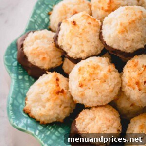 Ultimate Coconut Macaroons 12 A plate of chocolate-dipped coconut macaroons, showcasing their tempting appearance.