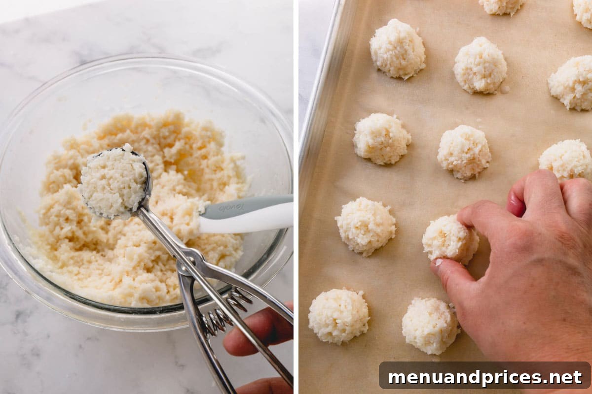 Ultimate Coconut Macaroons 7 Freshly baked coconut macaroons, golden brown and perfectly domed, cooling on a baking sheet.