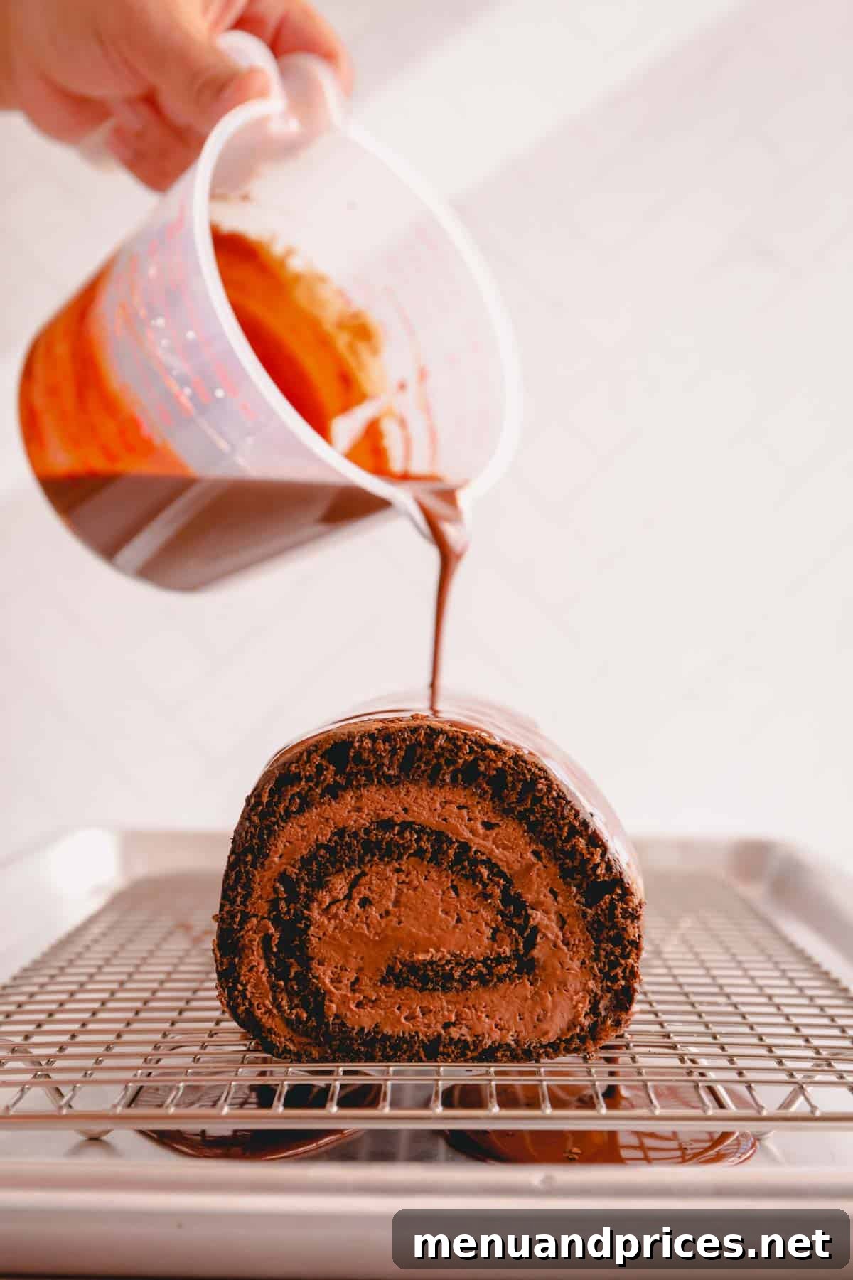 Sinful Chocolate Roll Cake 10 A hand carefully pouring rich, warm chocolate ganache over a chilled chocolate roll cake, allowing it to drip beautifully down the sides, creating a luxurious coating.