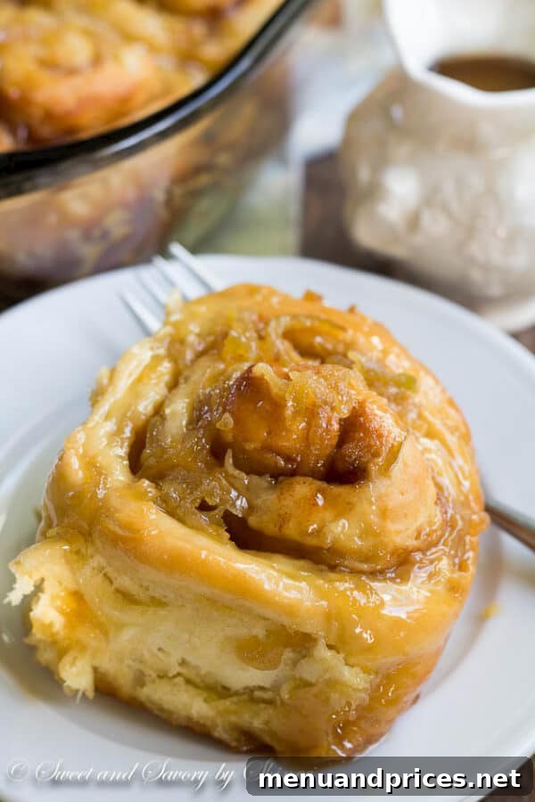 Apple Spice Swirls 2 Glorious homemade apple cinnamon rolls baked to golden perfection, generously topped with glistening apple caramel sauce.
