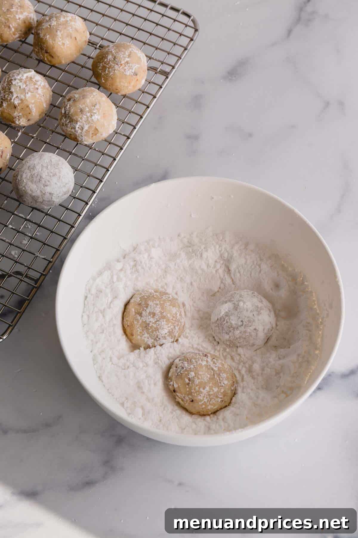 Buttery Pecan Snowball Cookies 14 Final snowball cookies, generously rolled in powdered sugar, ready to be served.