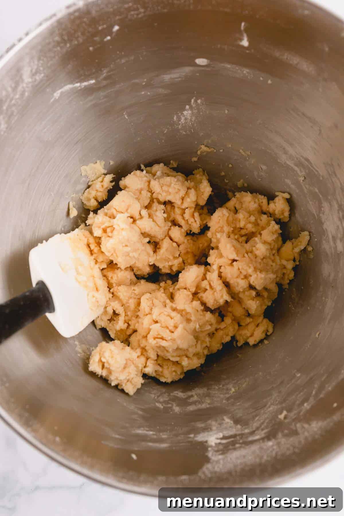 Buttery Pecan Snowball Cookies 7 Snowball cookie dough, rich and smooth, in a mixing bowl.