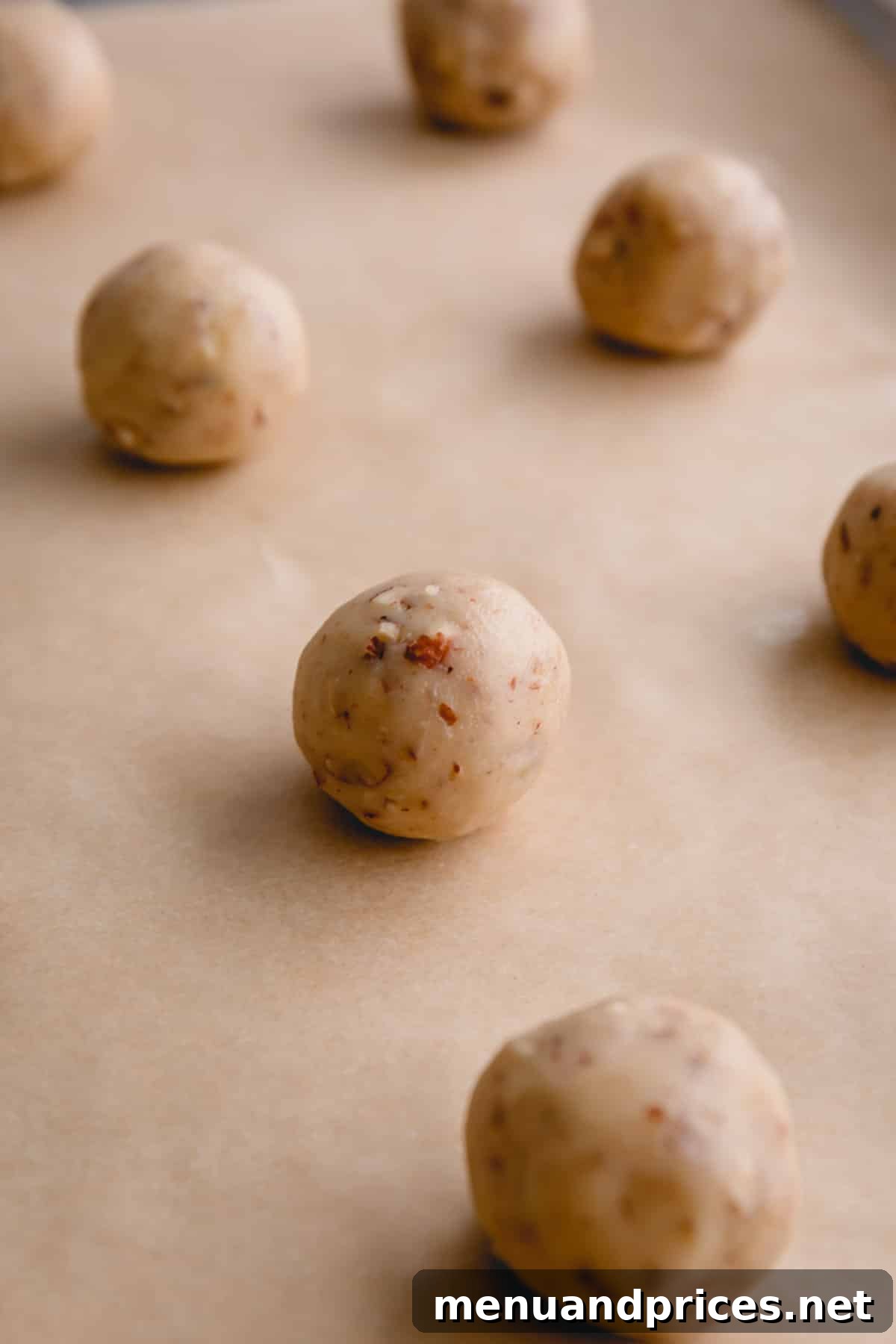 Buttery Pecan Snowball Cookies 10 Close-up of unbaked snowball cookie dough balls, showing their round shape.