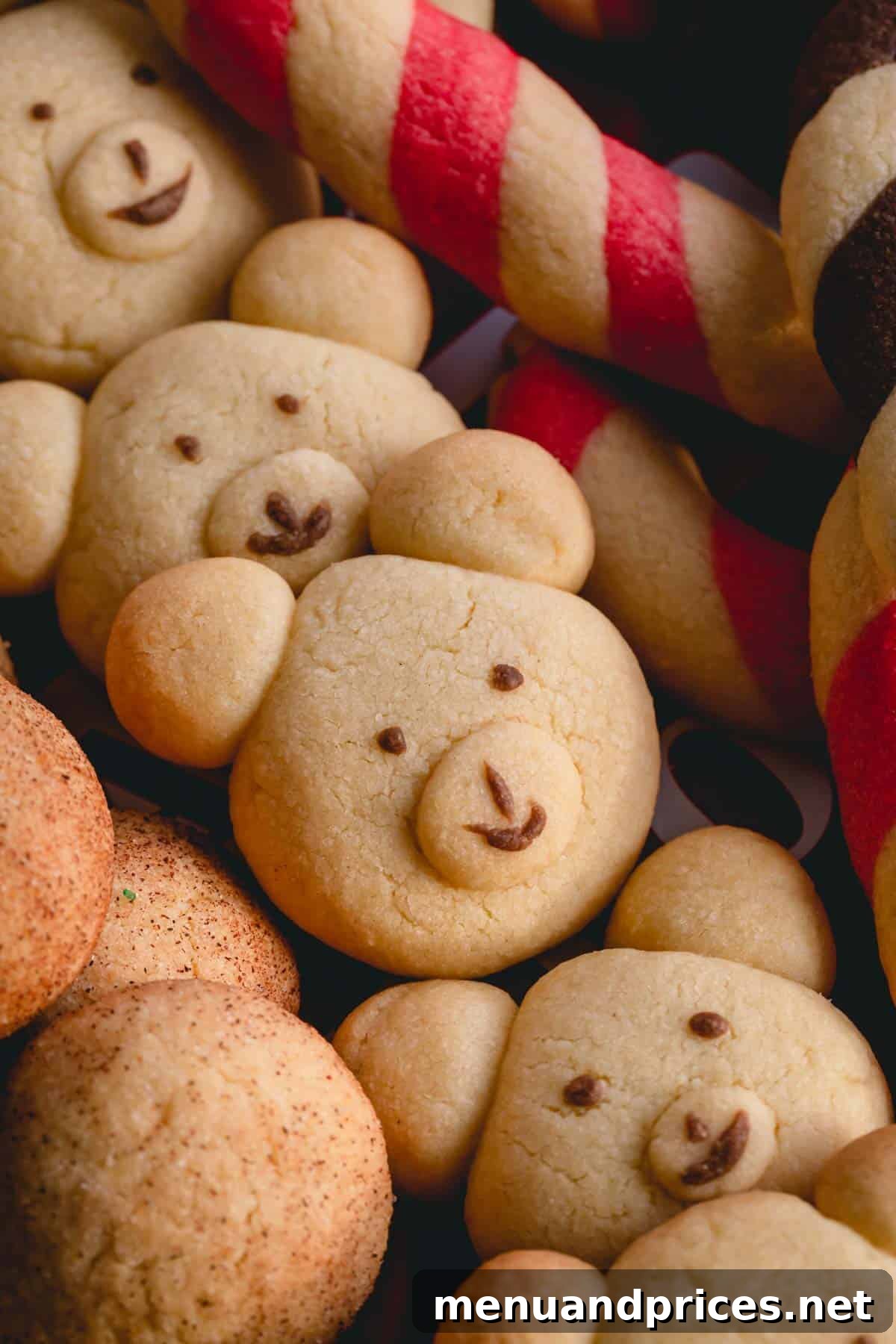 Baked bear cookies with chocolate faces arranged on a cookie platter.