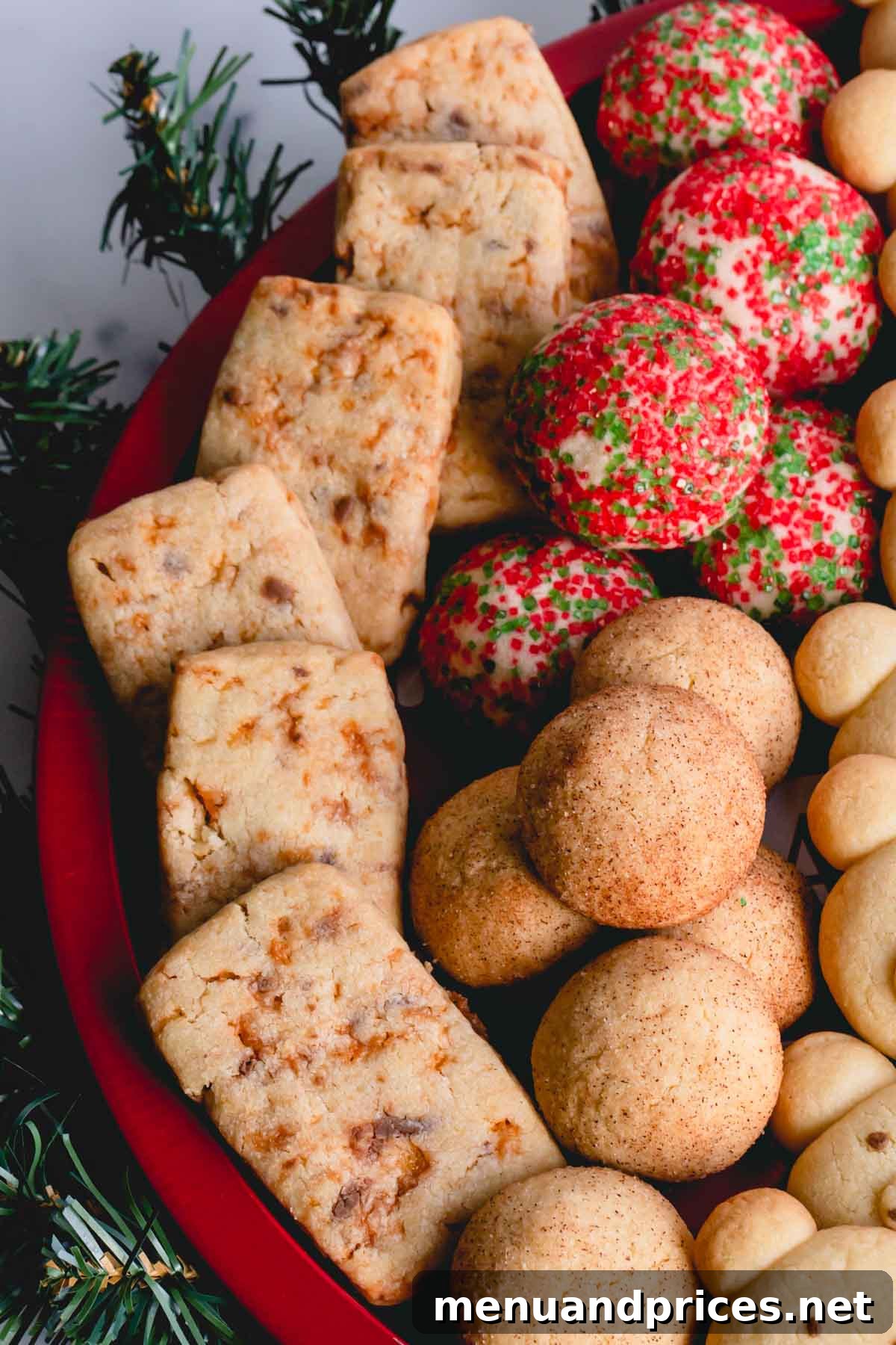 Baked Butterfinger butter cookies on a red platter, showcasing their golden color and crunchy texture.
