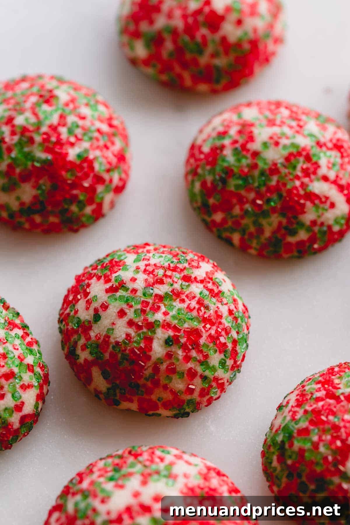 Baked red and green sugar coated cookies, vibrant and festive.