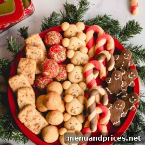 A round platter full of 6 varieties of of Christmas cookies.