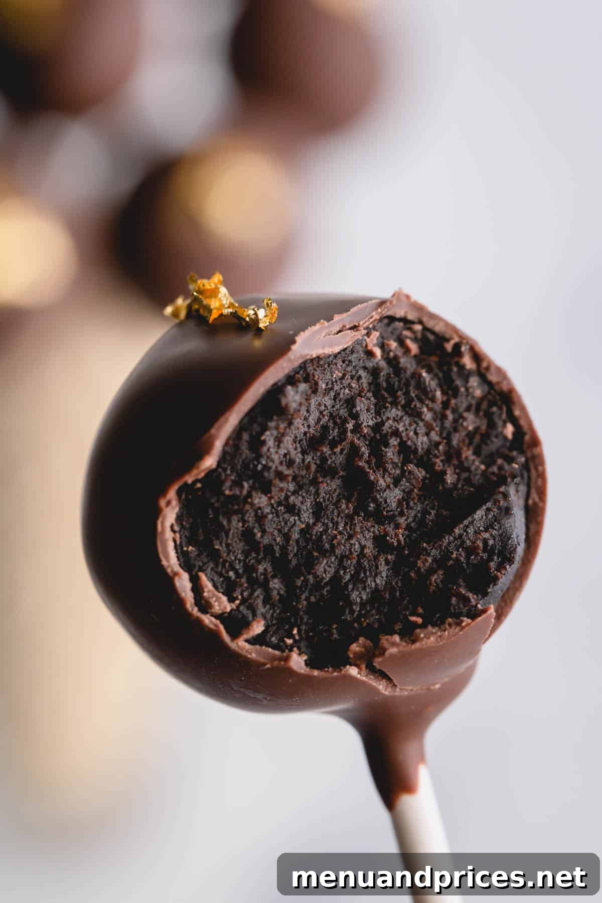 Crafting Perfect Chocolate Cake Pops From Scratch 11 a bite out of a chocolate cake pop.