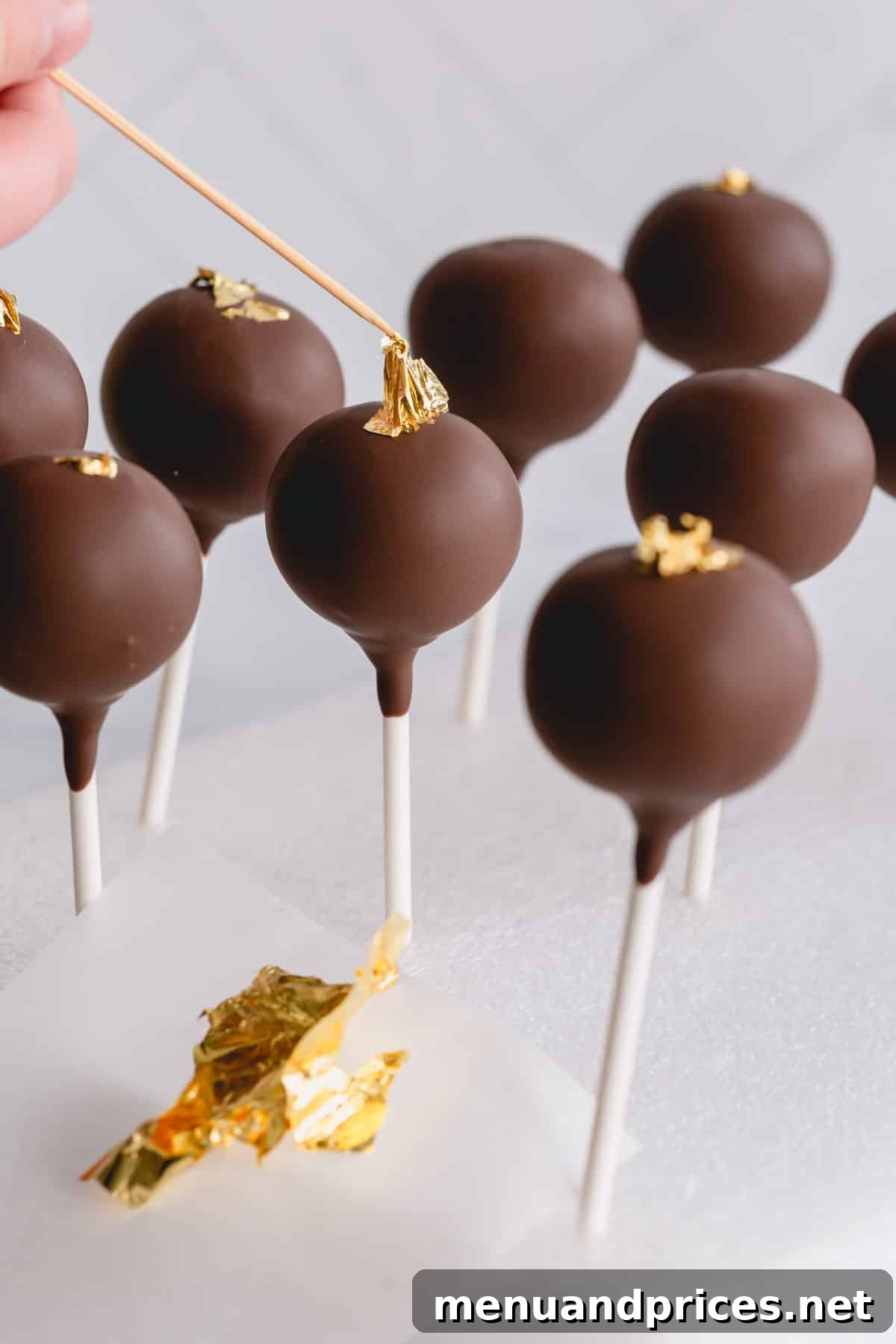Crafting Perfect Chocolate Cake Pops From Scratch 10 chocolate cake pops in styrofoam.