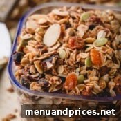 Wholesome Almond Crunch Granola 9 A scoop of delicious homemade almond granola with dried fruit.