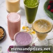 A close-up of a variety of smoothies, showcasing different colors and textures, suggesting the vast customization options for healthy beverages.