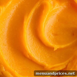 Close up of pineapple curd in a jar.