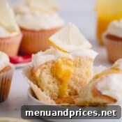 half of a lemon cupcake with lemon curd in the center.