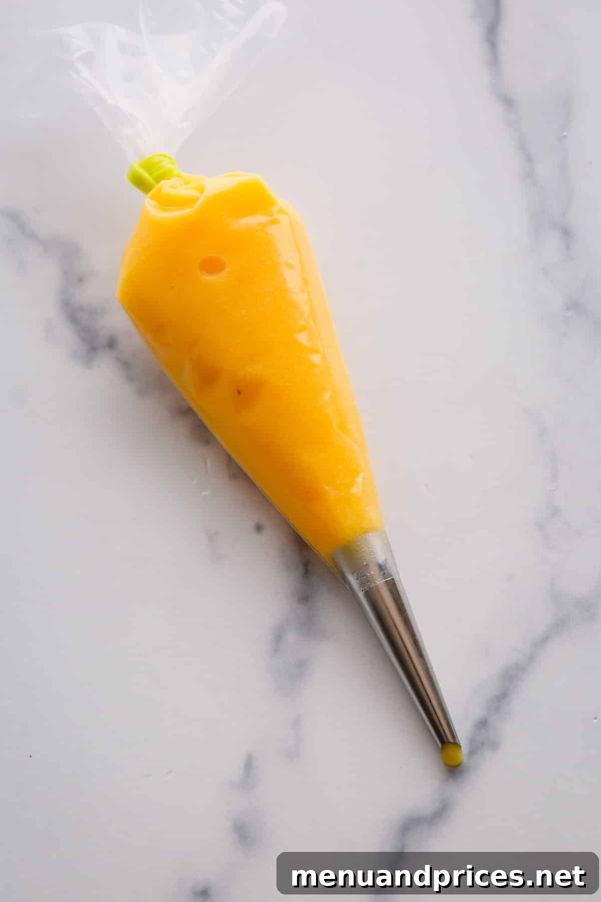 lemon curd in a piping bag.