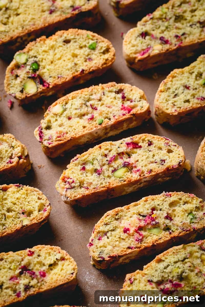 Crisp Cranberry Pistachio Biscotti 5 A selection of cranberry and pistachio biscotti cookies, beautifully arranged.