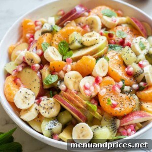 A bowl of fresh, vibrant honey lime fruit salad.