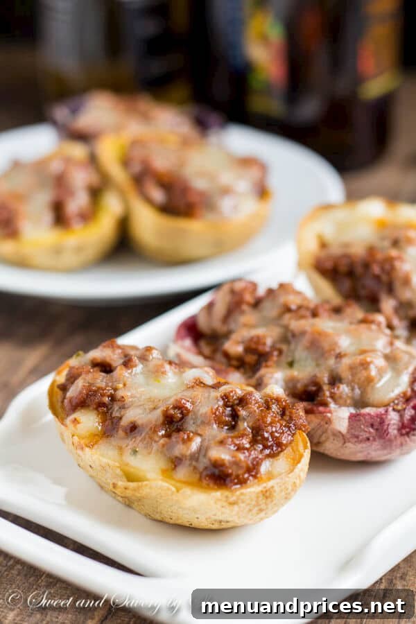 Loaded Joe Spud Boats 2 Extra crispy potato skins loaded with savory sloppy joes and melted cheese, a perfect American appetizer