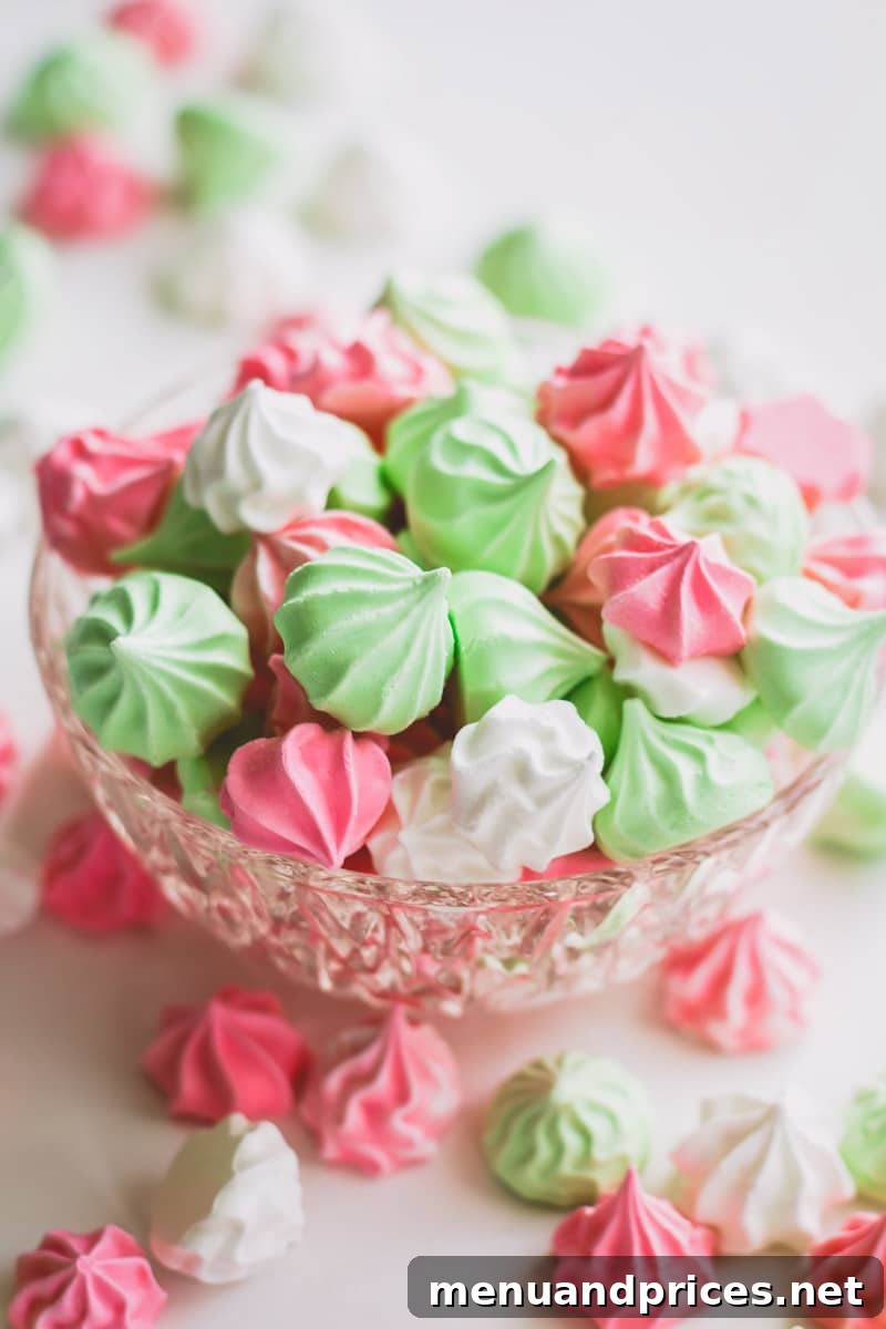 Effortless Meringue Delights 9 A vibrant bowl filled with an assortment of red, white, and green meringue cookies, ready for a festive celebration.