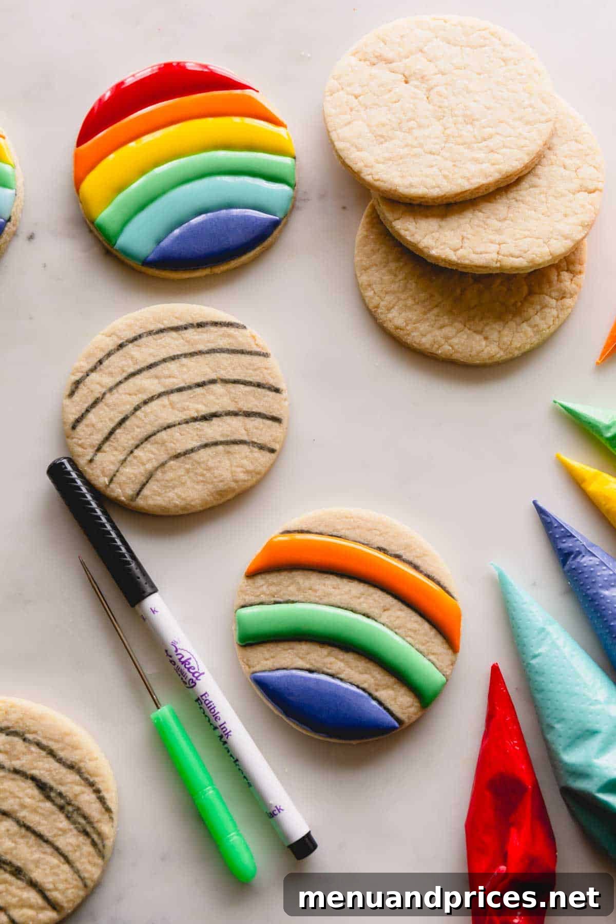 Mastering Royal Icing 10 Circular sugar cookies in the initial stages of decoration, showing outlines piped with rainbow royal icing.