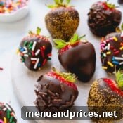 Chocolate covered strawberries coated with multi-color, chocolate, and gold sprinkles.