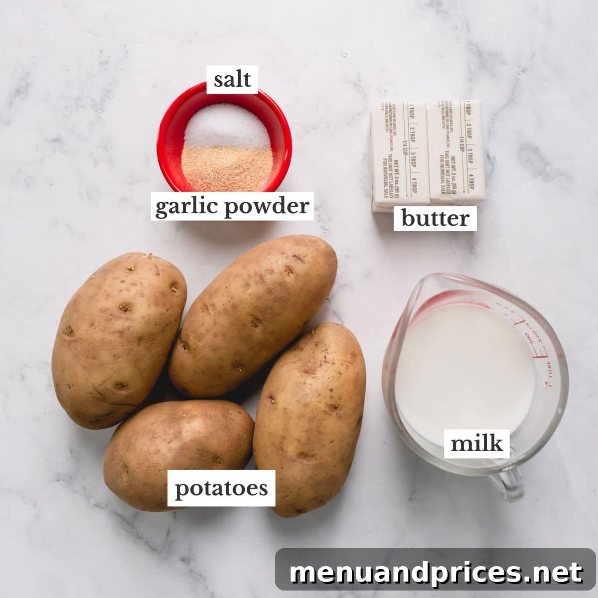 Potatoes, salt, garlic powder, butter, and milk to make brown butter mashed potatoes.