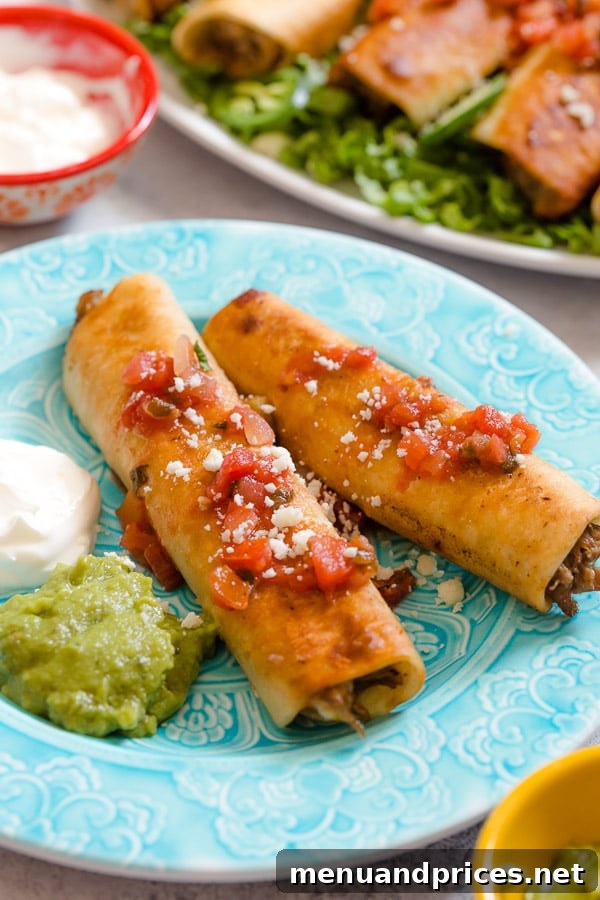 A close-up of a perfectly fried, golden-brown pulled pork flauta, showcasing its crispy texture and delicious filling, presented on a plate.