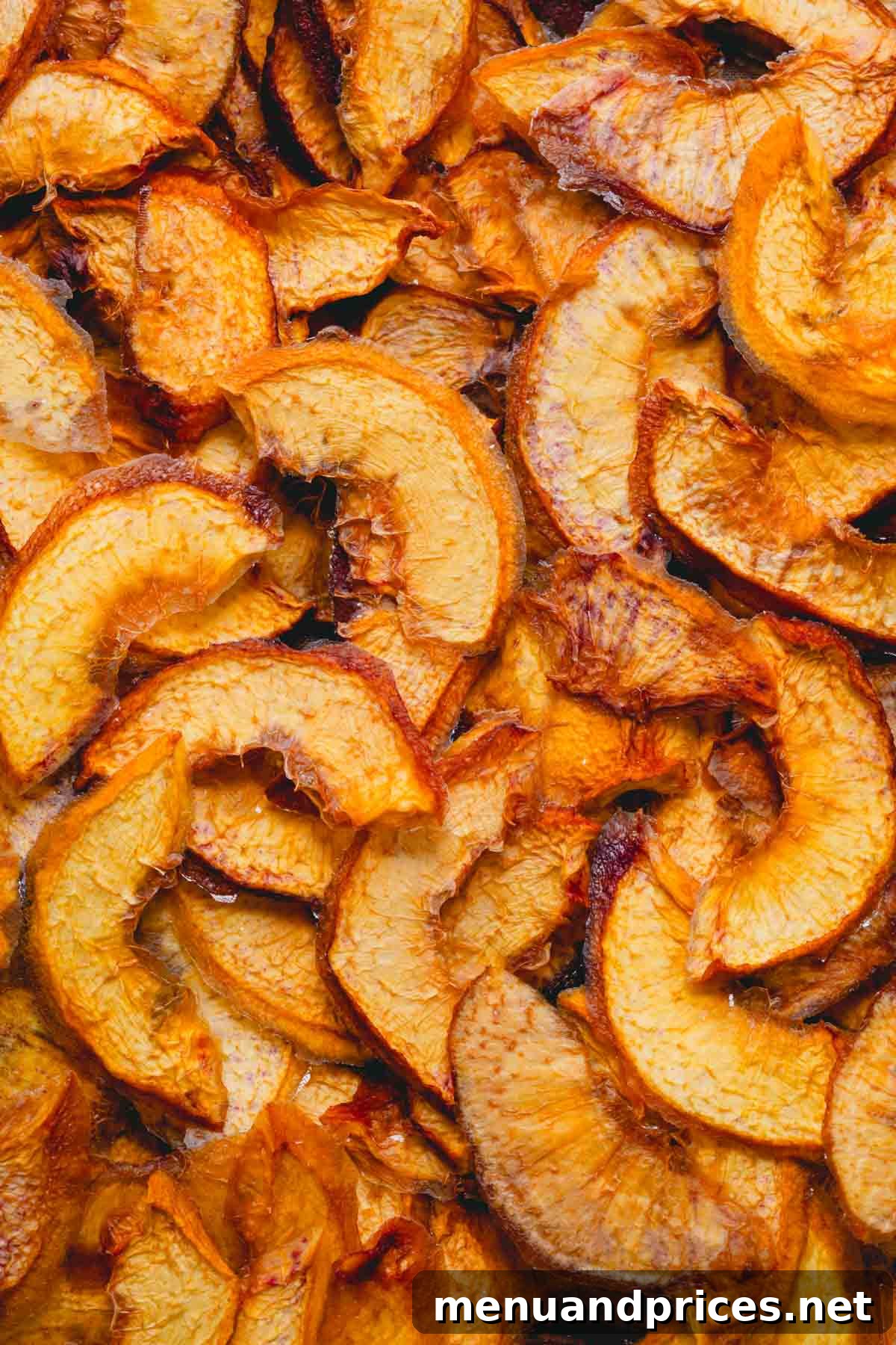 Close up image of beautifully textured dehydrated peach slices, showcasing their natural sweetness.