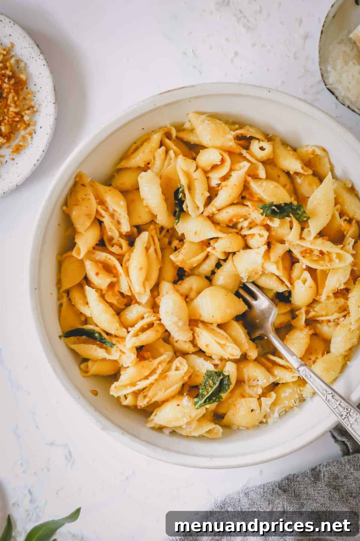 Effortless Brown Butter Pasta 3 A beautifully presented bowl of brown butter pasta with a fork ready to enjoy.