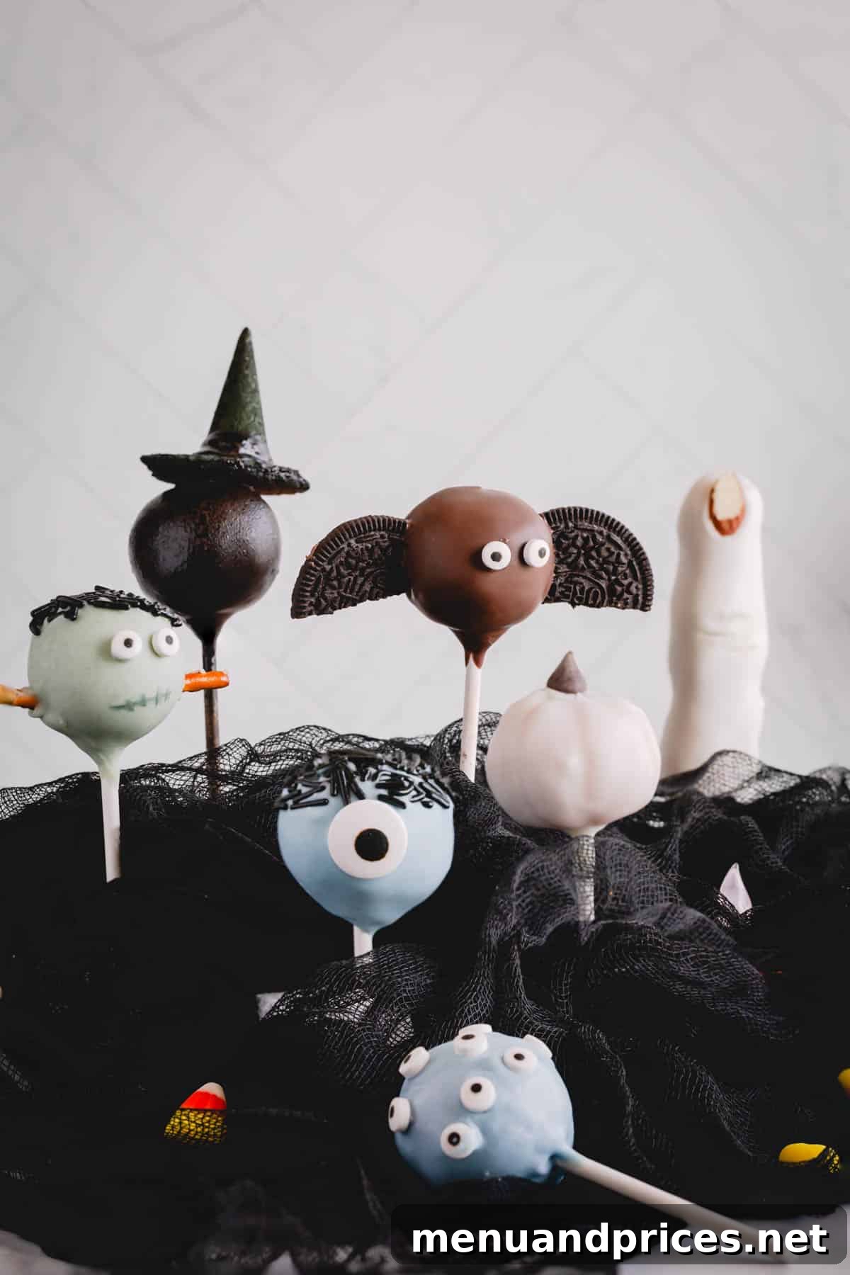An inviting arrangement of assorted Halloween cake pops, showcasing various decorative themes.