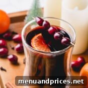 A small, inviting image of mulled wine, symbolizing a warm invitation to try the recipe.