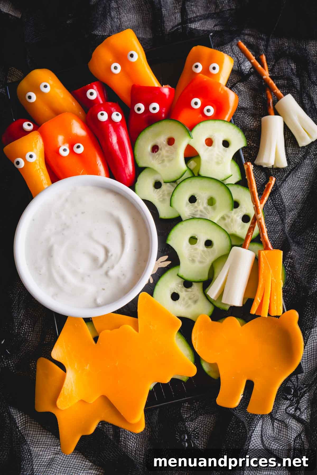 Two side-by-side images demonstrating the creation of cucumber skulls and cheese broomsticks for a Halloween snack board.