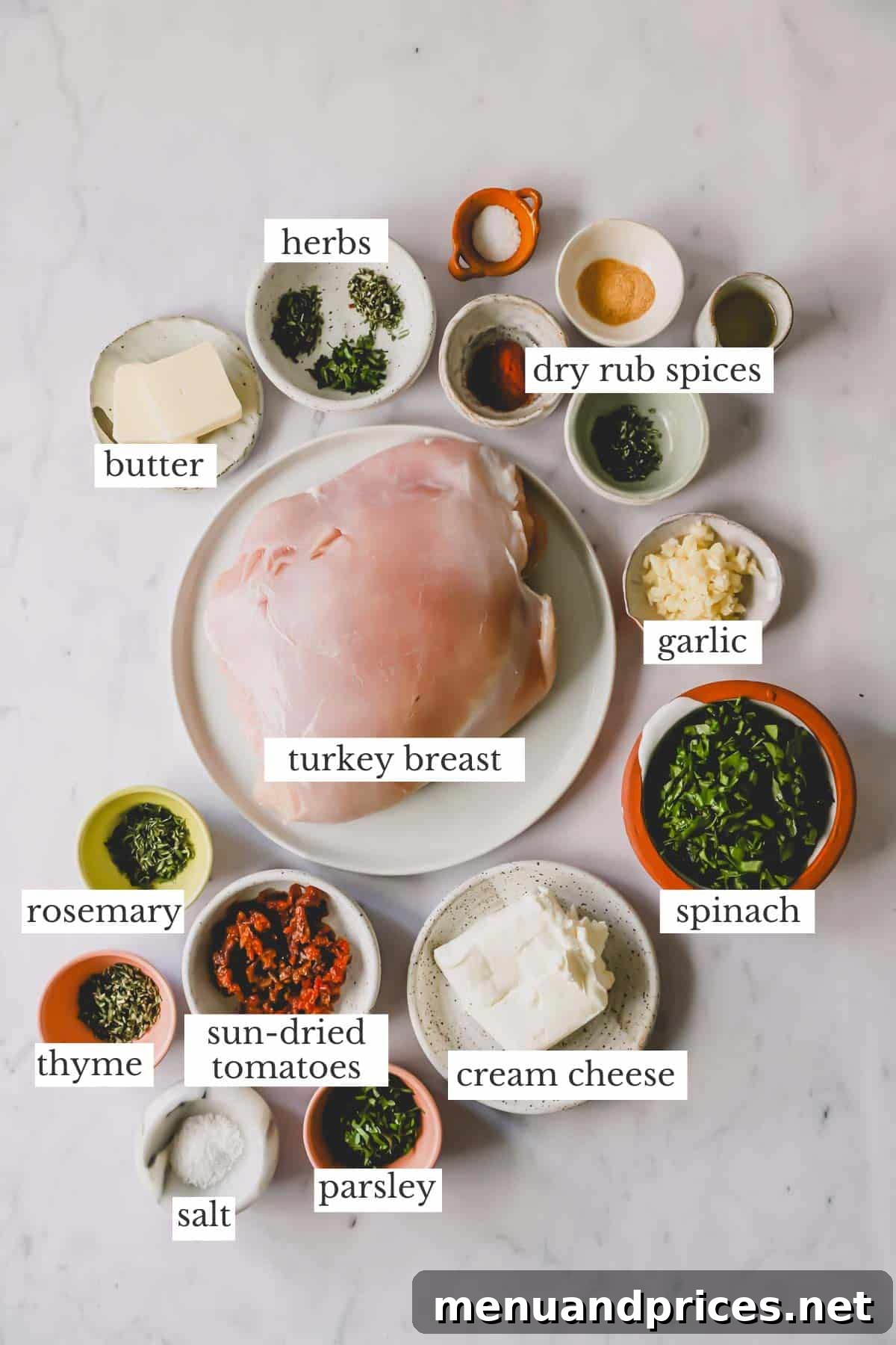 Collection of fresh ingredients arranged on a wooden board, ready to make stuffed turkey breast.