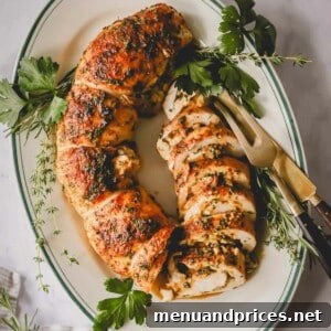 Overhead image of a sliced stuffed turkey on a serving platter.