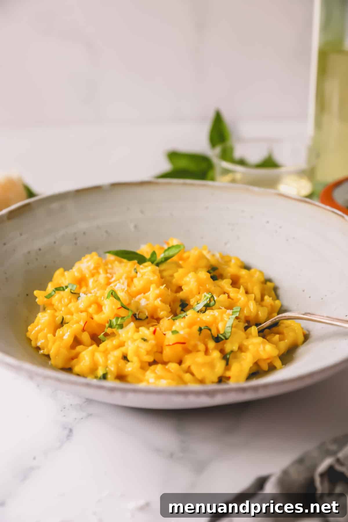 Express Golden Saffron Risotto 9 Side view of a beautifully presented bowl of saffron risotto with a spoon, highlighting its inviting texture.