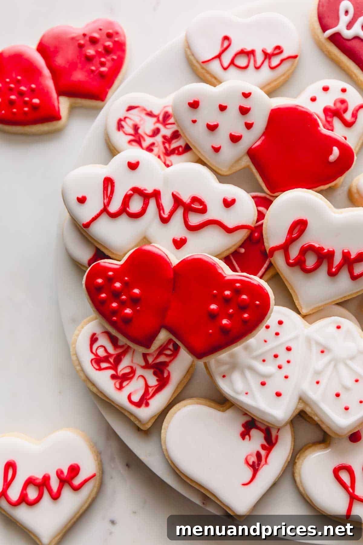 Sweetheart Sugar Cookie Delights 2 Valentine's Day sugar cookies with red and white icing.