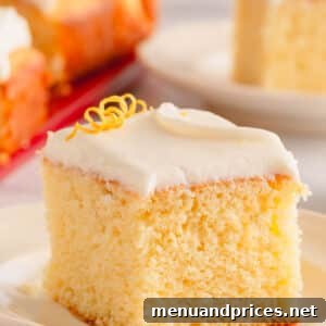 A slice of lemon sheet cake topped with lemon cream cheese icing, representing the final delicious product of the recipe.