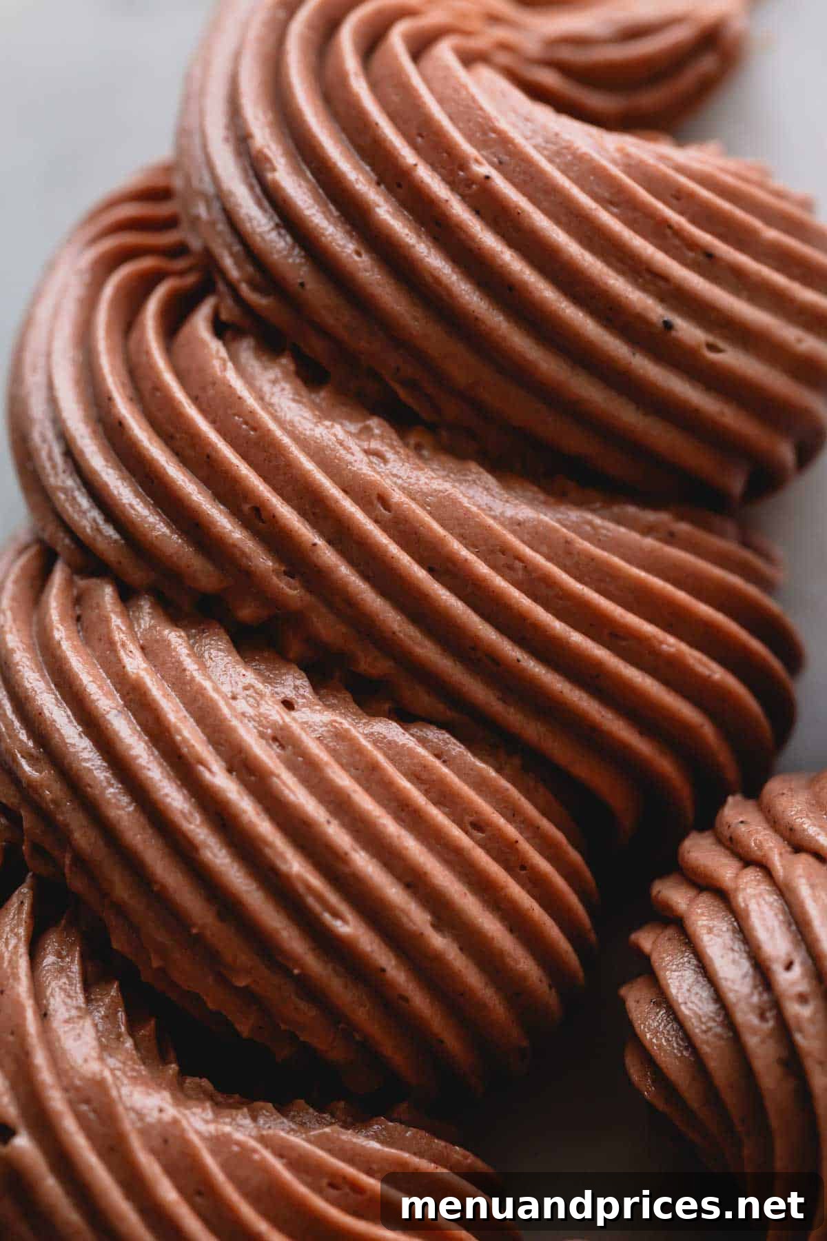 Luxe Chocolate Russian Buttercream 7 Another image of beautifully piped chocolate Russian buttercream, ready to adorn desserts.