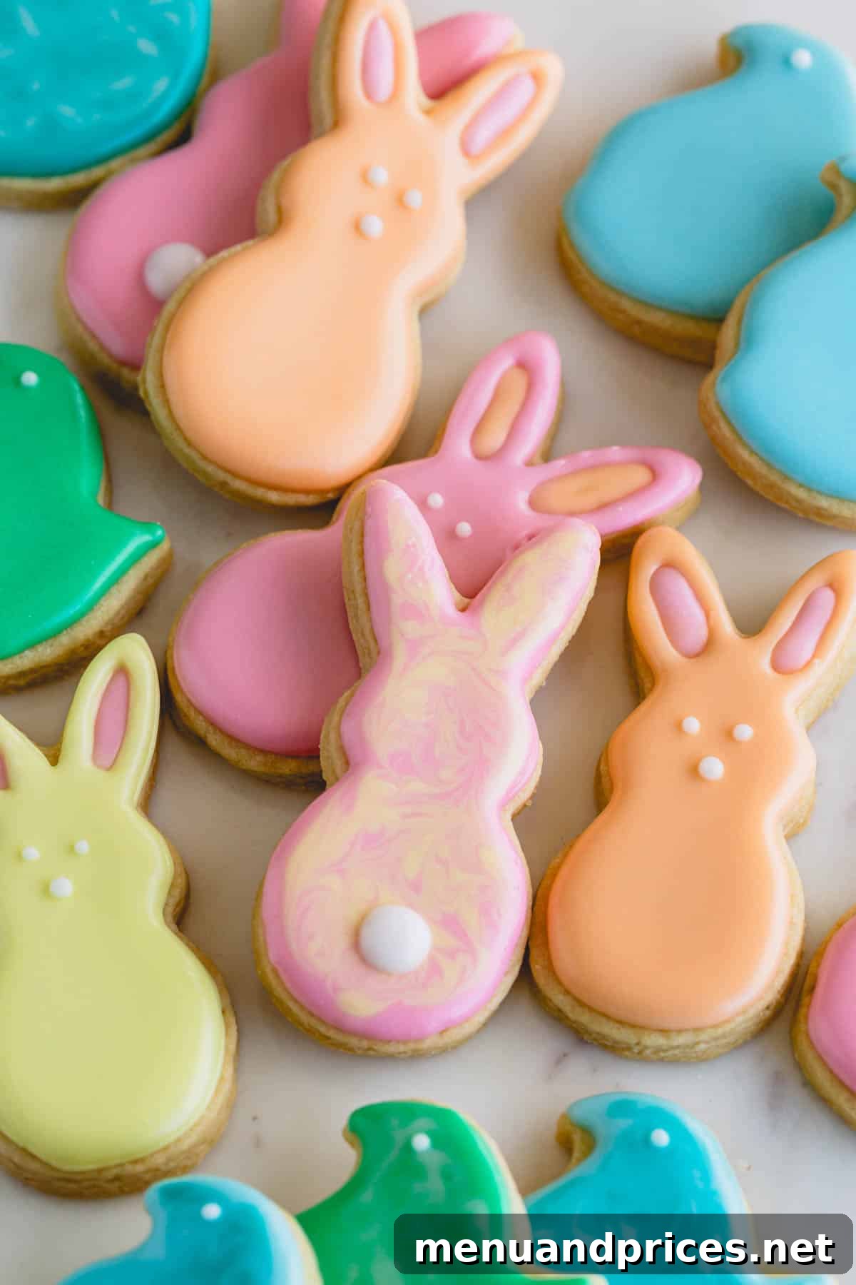 A vibrant assortment of Easter sugar cookies, intricately decorated with pastel royal icing.