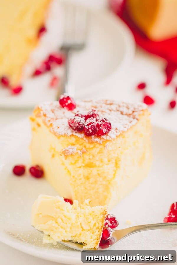 A slice of perfectly baked 3-ingredient soufflé cheesecake, showing its light and fluffy texture.