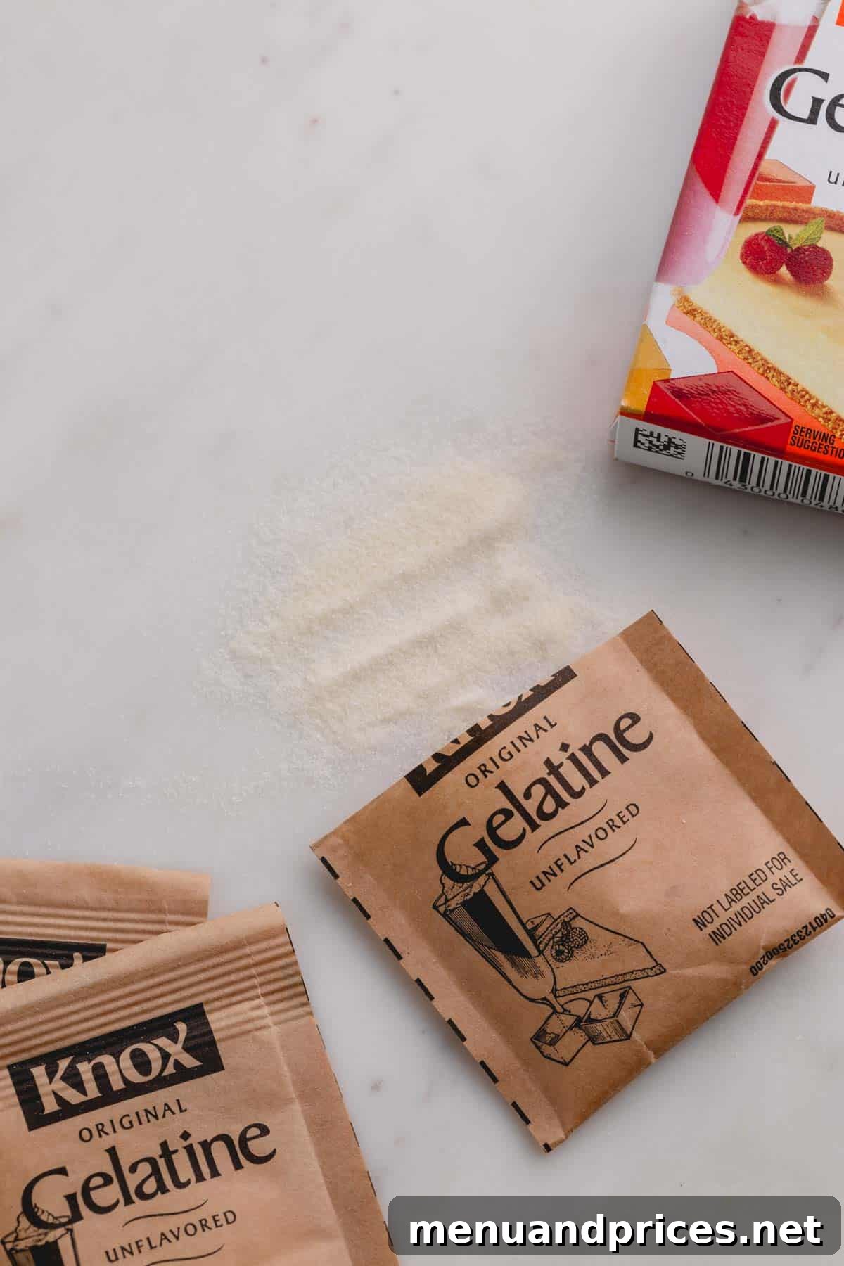 Mastering Thickening Agents 6 Packets of Knox unflavored gelatin on a white background with some gelatin powder spilled out, illustrating its common form.