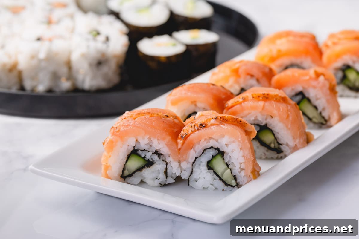 Crafting Delicious Sushi at Home 8 Smoked salmon covered cucumber rolls artfully arranged on a white plate, ready for serving.
