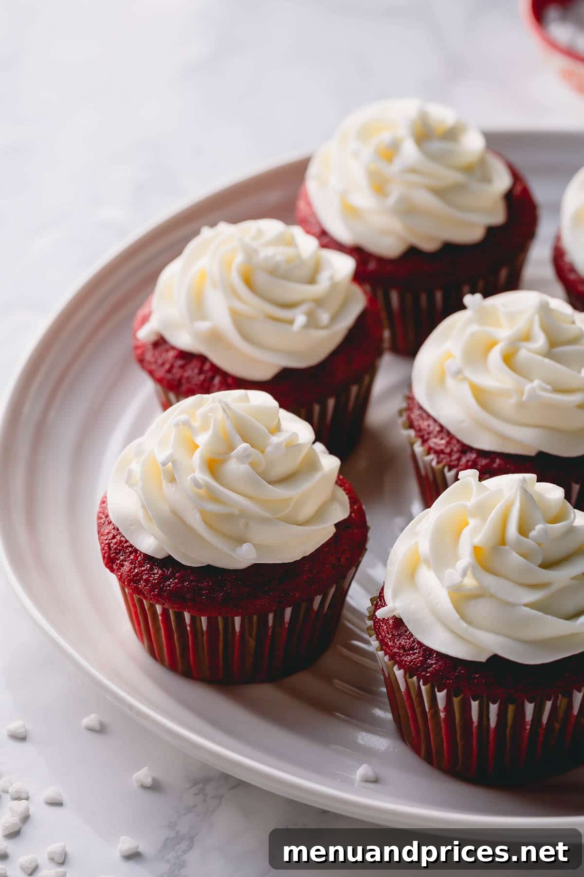 Effortless Cream Cheese Frosting Perfection 7 Half a dozen vibrant red velvet cupcakes elegantly frosted with homemade cream cheese frosting.