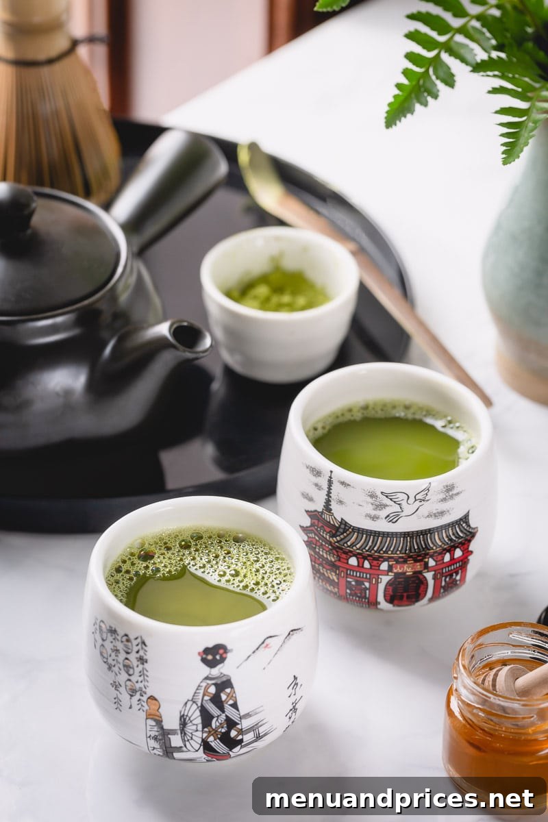 Matcha: A Beginner's Journey 5 A close-up of a cup of matcha tea, showing its vibrant green color and delicate foam.