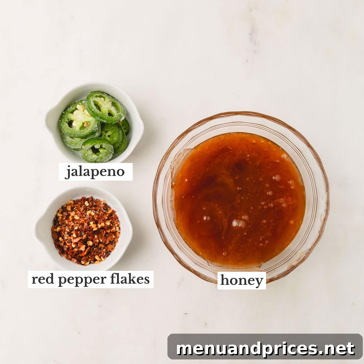Sweet Heat Honey Formula 4 Individual ingredients laid out: a jar of golden honey, vibrant red pepper flakes, and thinly sliced fresh jalapeño, ready to be combined.
