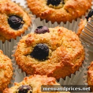Almond flour blueberry muffins topped with demerara sugar.