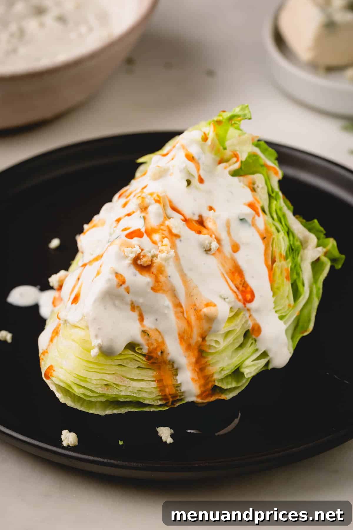 Golden Blaze Drizzle 10 A vibrant wedge salad, generously drizzled with creamy Ranch dressing and a tantalizing swirl of hot honey sauce, garnished with blue cheese crumbles.
