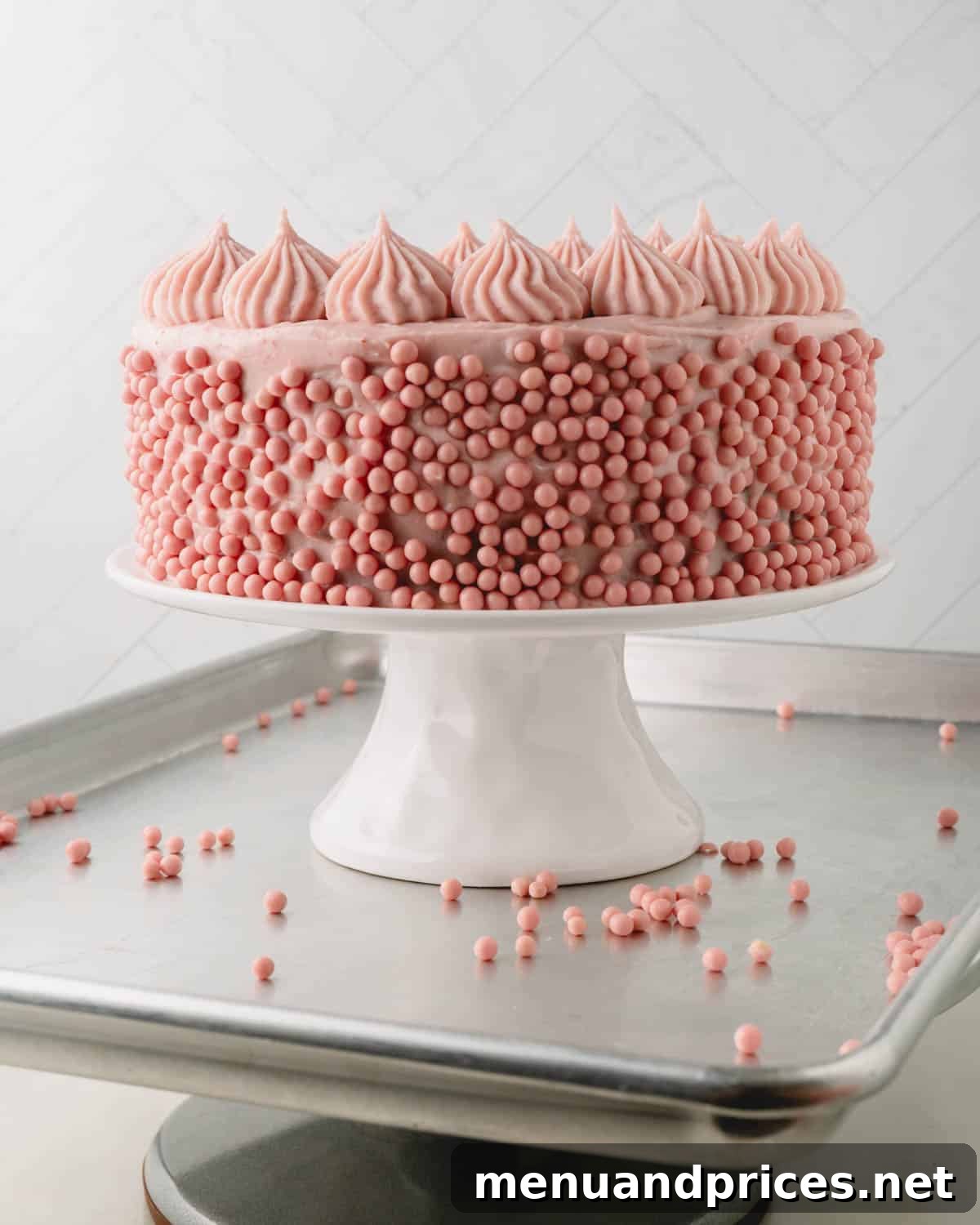 Sweet Strawberry Dream 18 A beautifully decorated strawberry cake on a cake stand, with strawberry pearls elegantly sprinkled on the side, ready for its grand reveal.