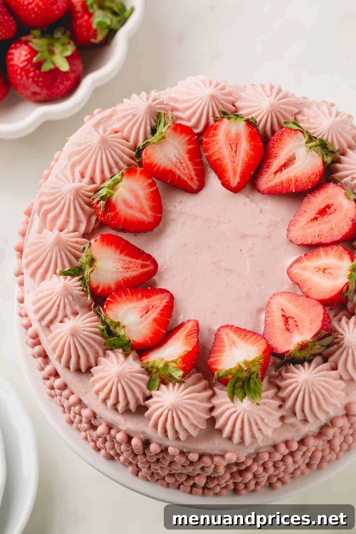 Sweet Strawberry Dream 19 A stunning layered strawberry cake, artfully adorned with creamy strawberry cream cheese frosting, fresh strawberry slices, and delicate strawberry pearls, creating a truly irresistible dessert.