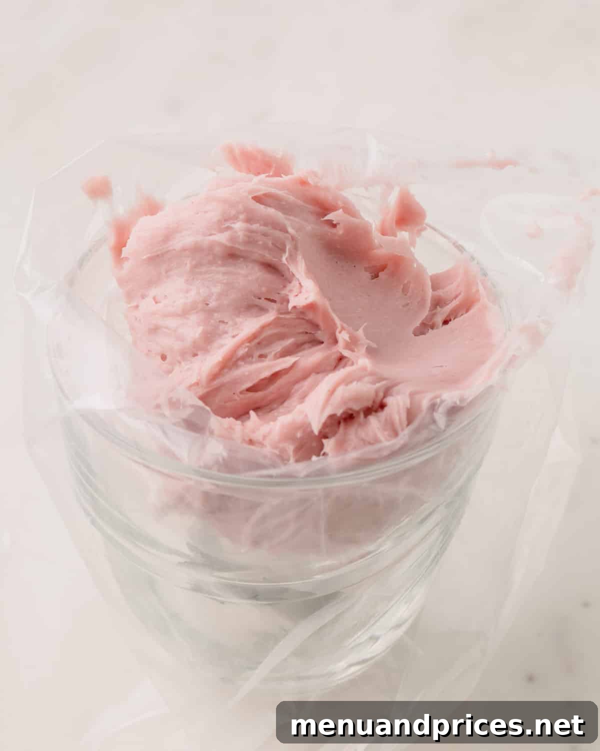 Strawberry Silk Dairy Free Ganache 9 Dairy-free strawberry ganache, perfectly set and smooth, ready in a piping bag with a star tip, showcasing its excellent pipeable consistency.