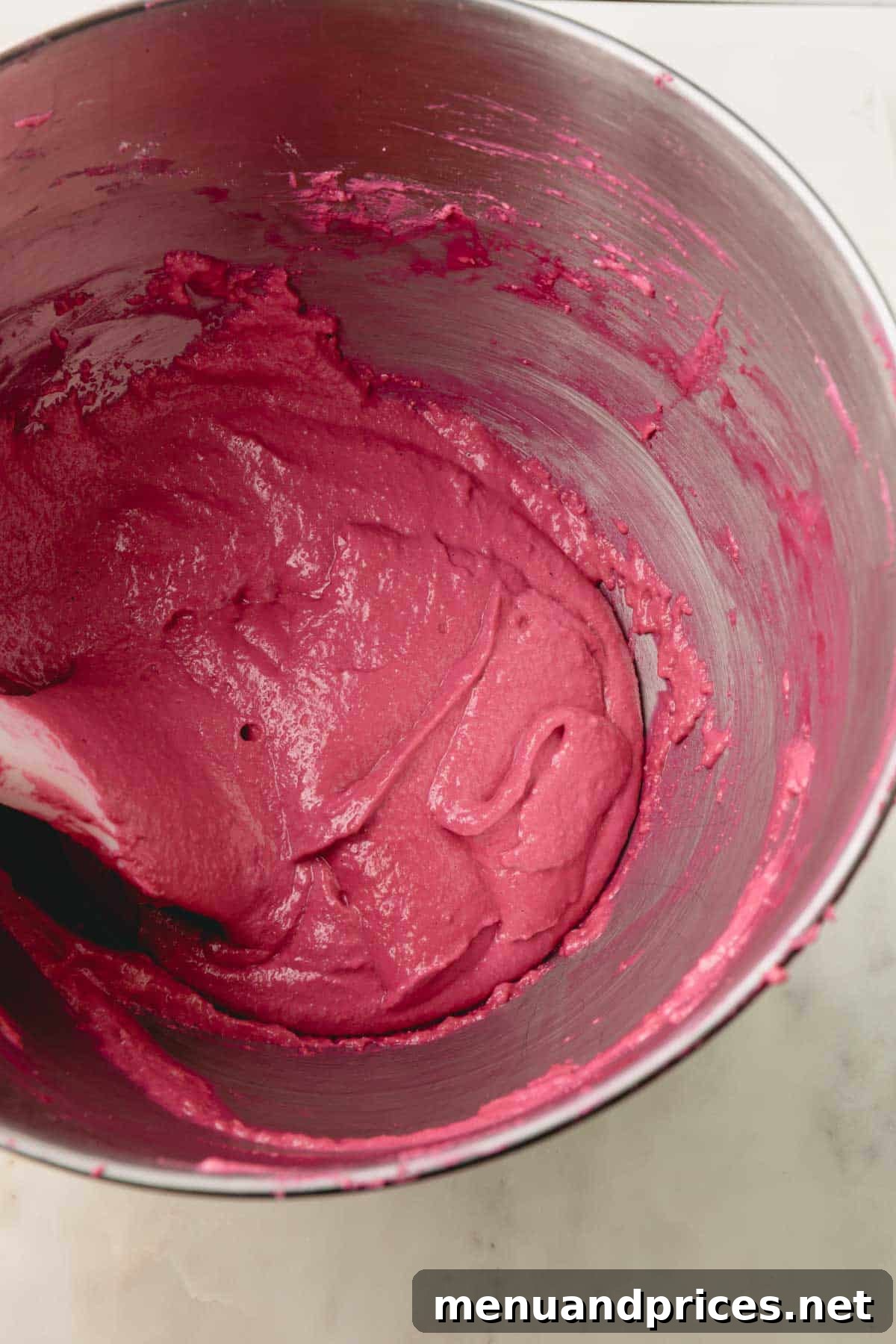 Another view of the cranberry macaron batter in a bowl, showcasing its perfect texture.